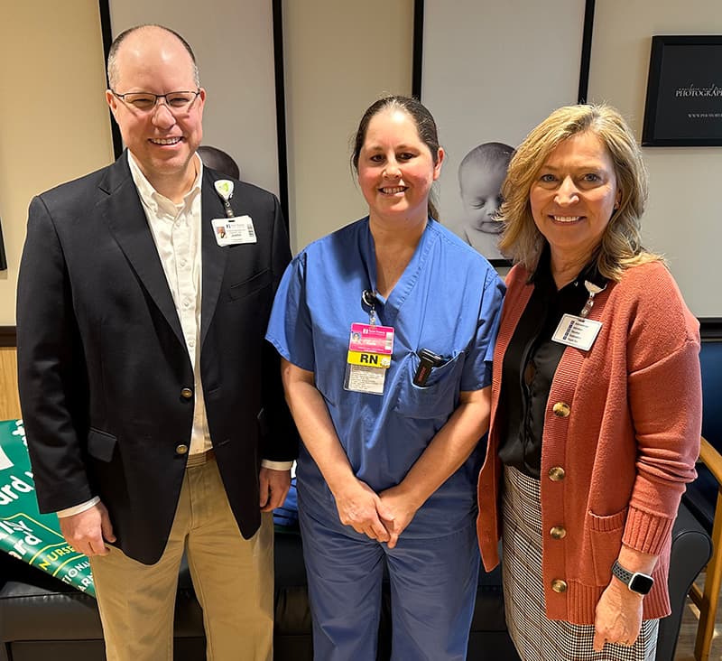 DAISY Award winner Katie Childs, RN with Saint Francis President and CEO Justin Davison and Chief Nursing Officer Debby Sprandel, RN, BSN, MSN, MBA-HA