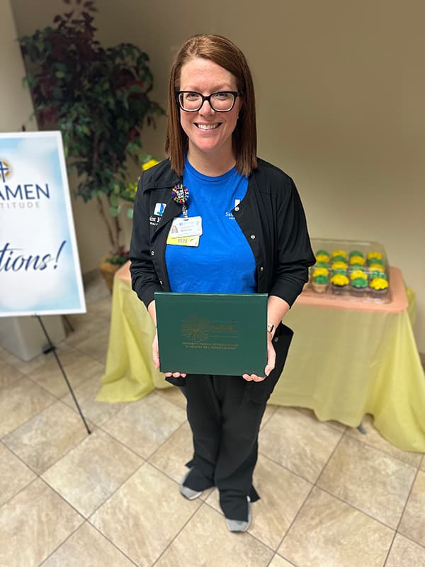 Suzanne Bickings displays her DAISY Award