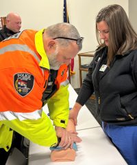 Lieutenant Rick Schmidt of the Cape Girardeau Police Department practices applying pressure techniques under the guidance of Advanced Practice Provider Rachel Peck, NP.